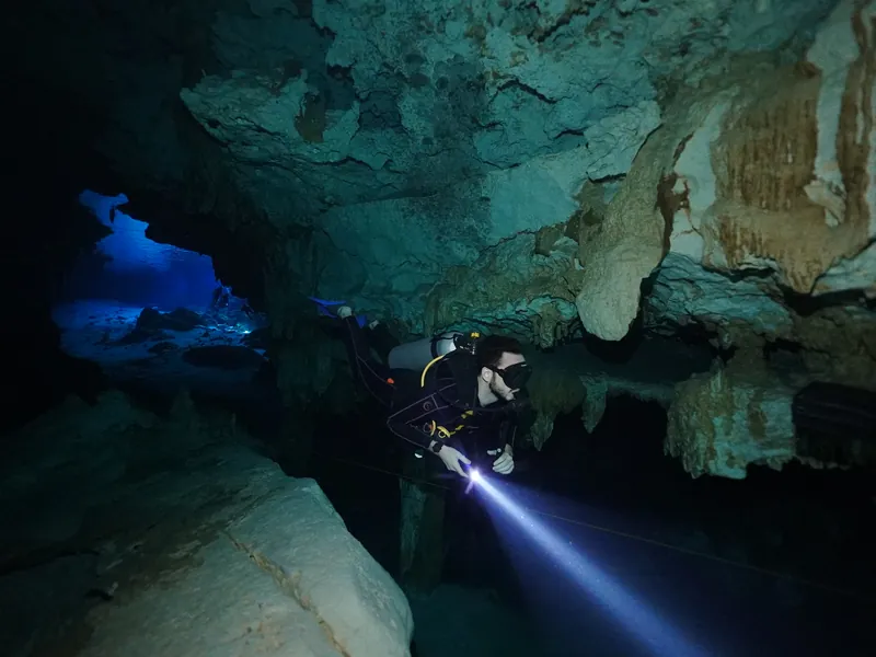 Dos Ojos cenote cavern dive with crystal clear freshwater visibility in Tulum